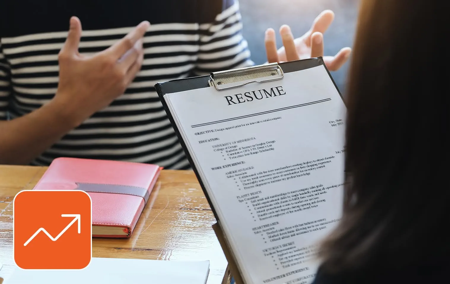 Professional job candidate reviewing resume and skills checklist